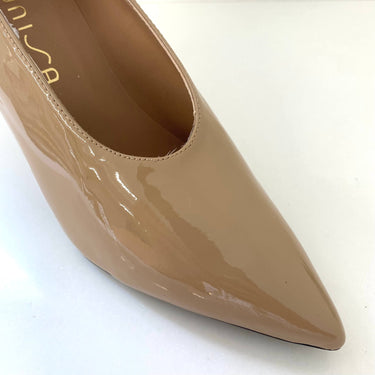 Beige high-heeled shoe on a white background