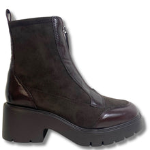 A dark brown ankle boot with a mix of suede and patent leather panels, featuring a chunky platform sole and a side zipper, shown against a plain white background.
