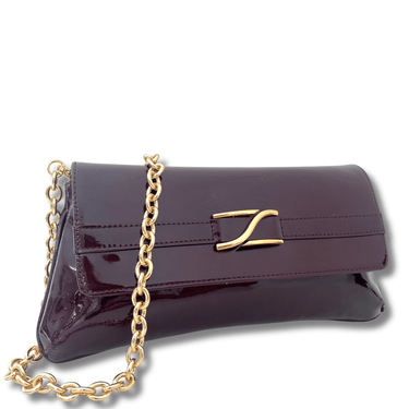 Purple clutch bag with gold chain and clasp on a white background