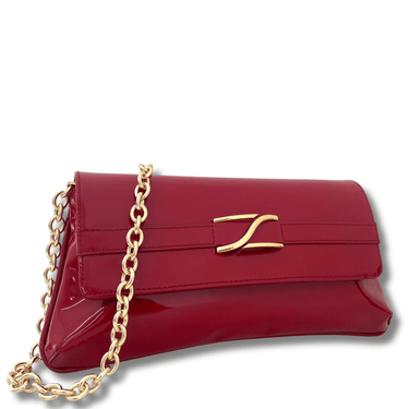 Red handbag with gold chain and clasp on a white background