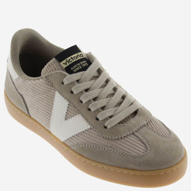 Gray sneaker with white accents on a white background