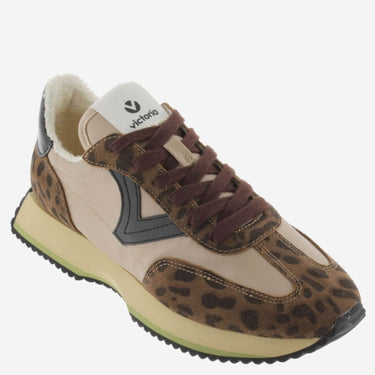Sneaker with leopard print pattern on a white background