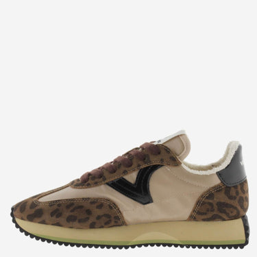 Sneaker with leopard print pattern on a white background