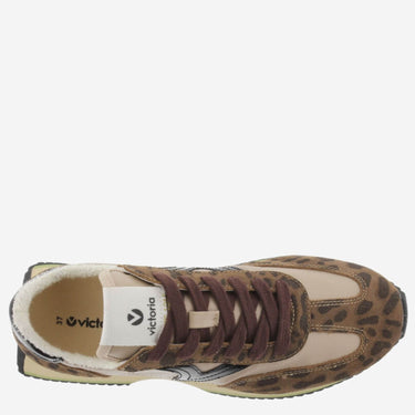 Sneaker with leopard print pattern on a white background