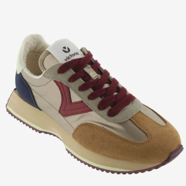 Multicolor sneaker with maroon laces on a white background