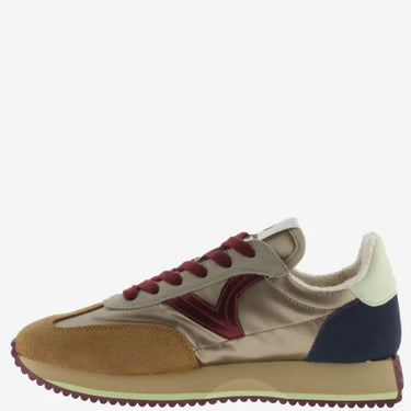 Multicolored sneaker with brown, red, and blue accents on a white background