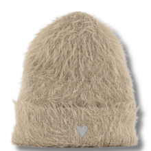 Beige fuzzy knit beanie with a heart emblem on a white background