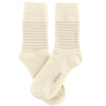 Pair of cream socks on a white background