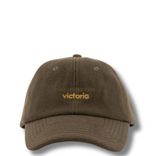 Brown cap with 'Victoria' text on a white background