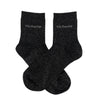 Pair of black socks with 'Victoria' branding on a white background