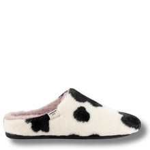 A single plush slip-on mule slipper with a black and white cow-print pattern, featuring a soft pink lining and a small white brand tag on the side.
