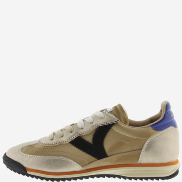 Beige sneaker with black, orange, and blue accents on a white background