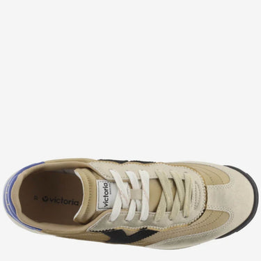 Beige sneaker with white laces and visible 'Victoria' branding on a white background