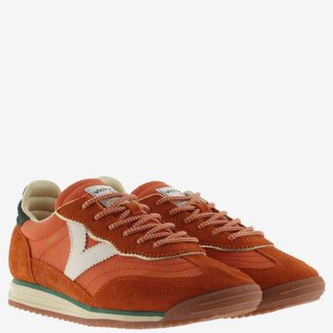 Pair of orange sneakers with white accents on a white background
