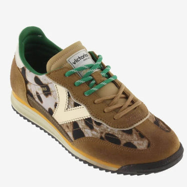 Brown sneaker with leopard print pattern and green laces on a white background
