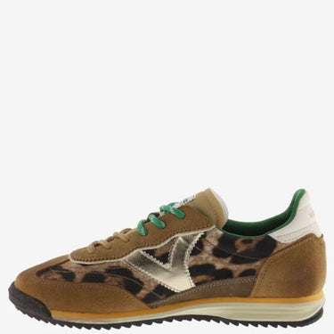 Brown sneaker with leopard print and green accents on a white background