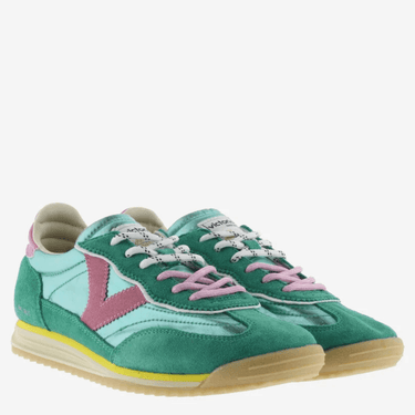 Green and pink sneakers with a visible brand logo on a white background