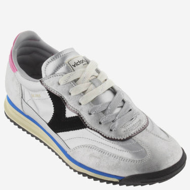 Gray sneaker with black and blue accents on a white background