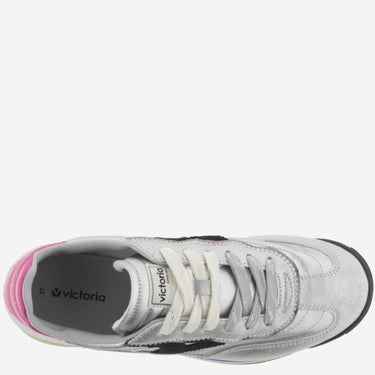 silver grey sneaker with pink sole on a white background