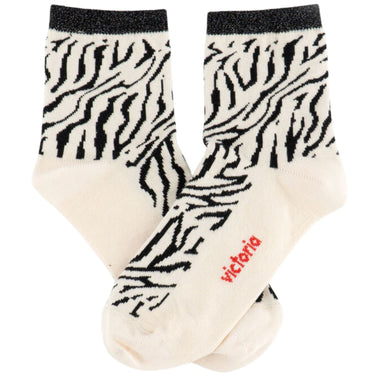 Pair of socks with zebra pattern and 'Victoria' branding on a white background