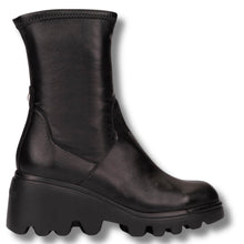 A black leather mid-calf boot with a chunky, rugged lug sole, shown from a side profile view against a white background.