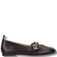 Brown leather flat shoe with a decorative buckle on a white background