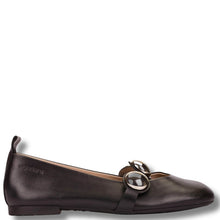 Brown leather flat shoe with a decorative buckle on a white background