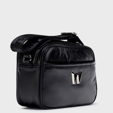 Black leather bag with a brand logo on a light gray background