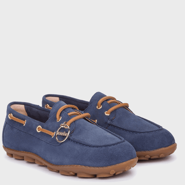 Pair of blue suede shoes with brown laces and soles on a white background