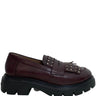Brown leather loafer with chunky sole on a white background