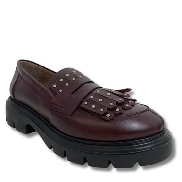 Brown loafers with studded details on a white background