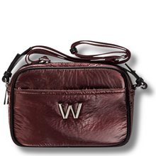 Brown leather crossbody bag with a visible brand logo on a white background
