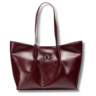 Brown leather tote bag with a visible brand logo on a white background