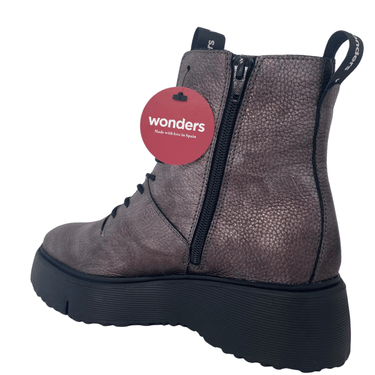 Gray boot with a 'wonders' tag on a white background