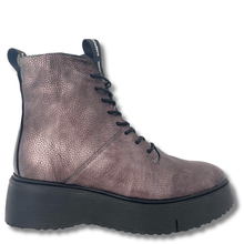 pewter leather boot with black sole on a white background
