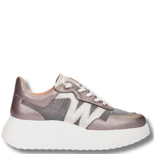 Metallic sneaker with white sole on a light gray background