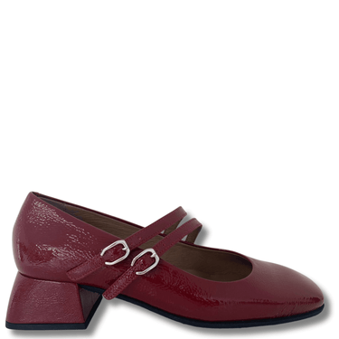 Red high-heeled shoes with a strap on a white background