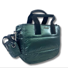 A shiny dark green puffer tote bag with black handles and a matching small side pouch, photographed on a white background.