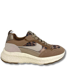 A low-top sneaker in shades of brown, beige, and gray, featuring a leopard print pattern on the toe and side panels, a chunky textured off-white sole, and gray laces.