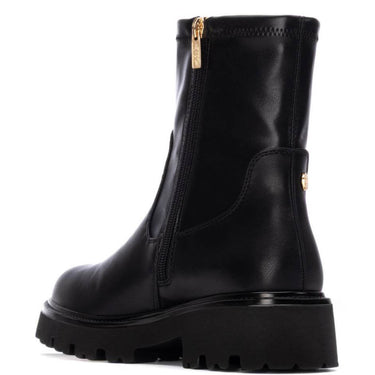 Black leather boot with gold zipper on a white background