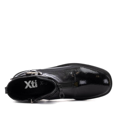 Black shoe with 'Xti' branding on a white background