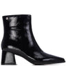 A black patent leather ankle boot with a pointed toe and a chunky block heel, shown from a side profile on a white background.