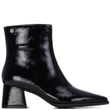 A black patent leather ankle boot with a pointed toe and a chunky block heel, shown from a side profile on a white background.