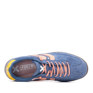Blue sneaker with pink laces on a white background