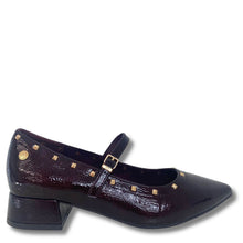 A dark burgundy Mary Jane shoe with a textured crocodile-embossed finish, gold-tone studs, and a block heel, shown against a plain white background.