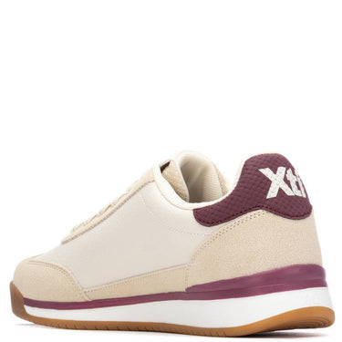 Beige sneaker with maroon accents and 'Xt' logo on a white background