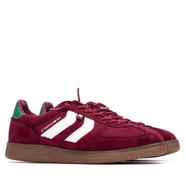 Maroon sneaker with white stripes on a white background