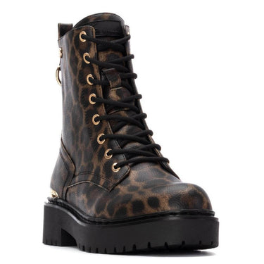 Leopard print boot with black sole on a white background