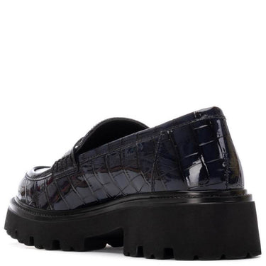 navy platform shoes with a textured design on a white background