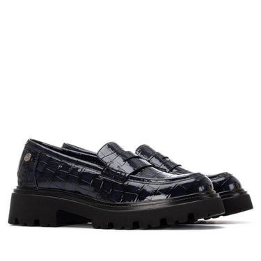 navy crocodile-patterned loafers on a white background
